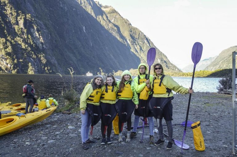 Pauline, with daughters and friends, getting ready to kayak in the Milford Sound, New Zealand. Courtesy of Pauline Frommer.